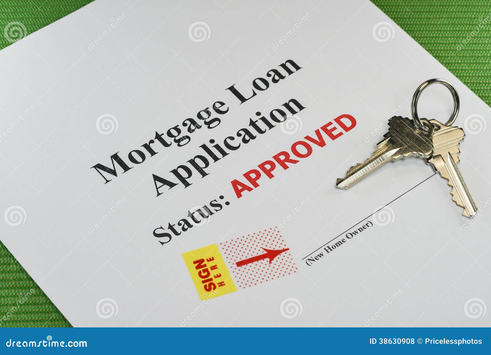 Mortgage application approval documents on a clipboard with house keys nearby.