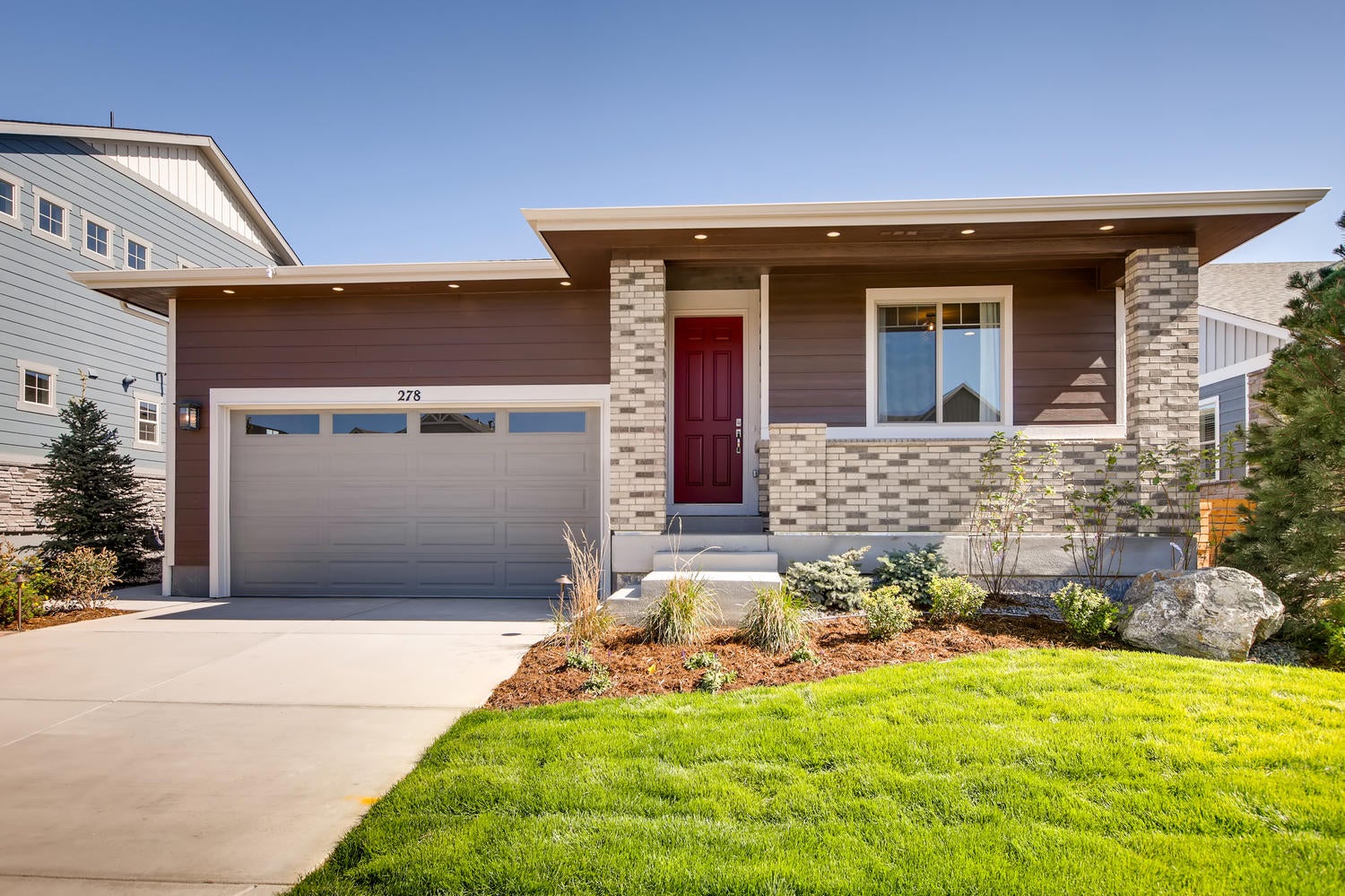 Photo of a welcoming Colorado suburban home with siding and mountain backdrop