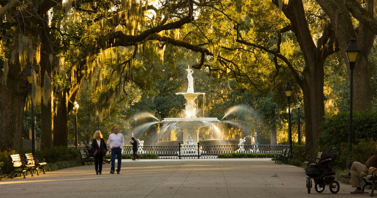 people standing near fountain during daytime