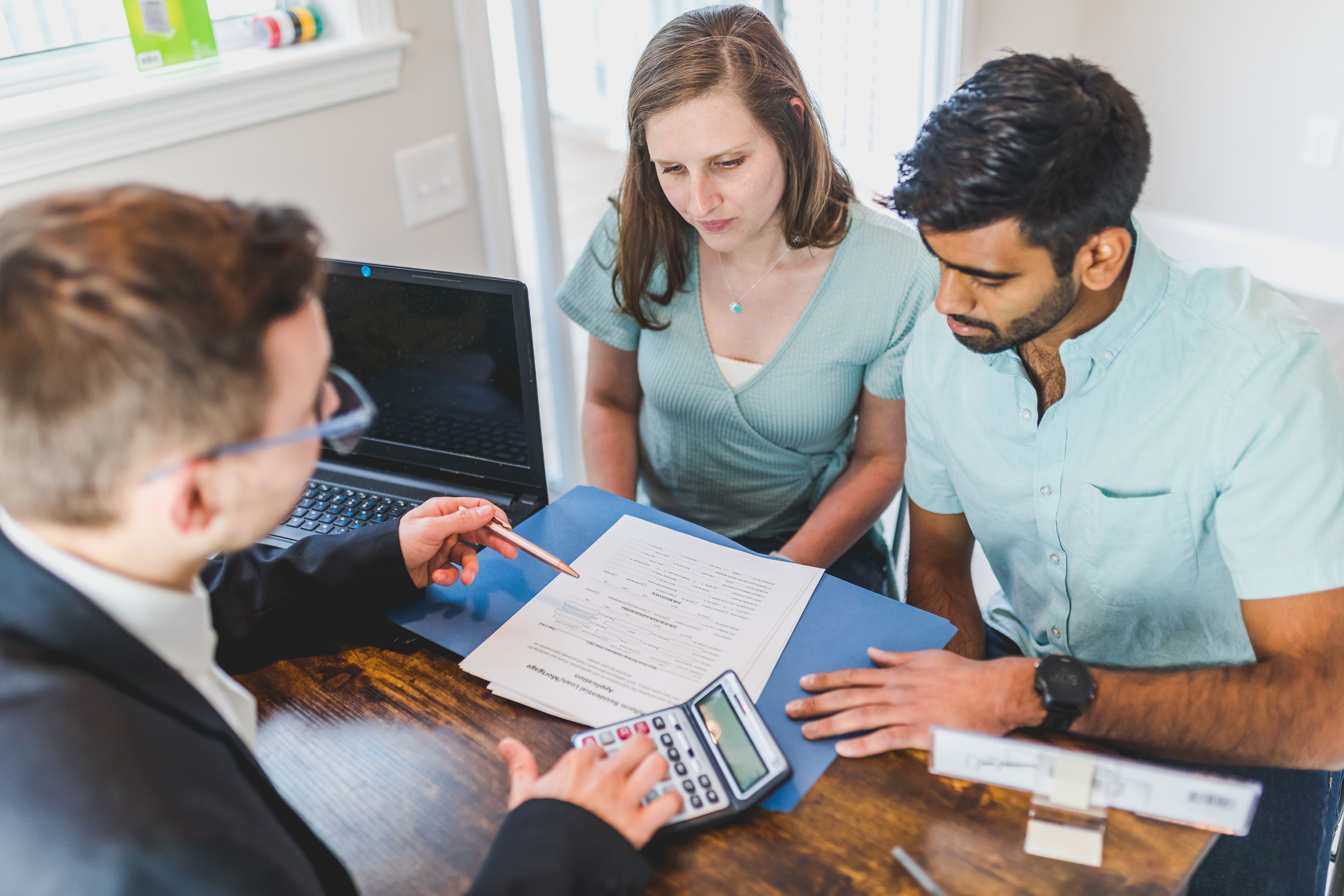 Real estate professional assisting with divorce sale paperwork
