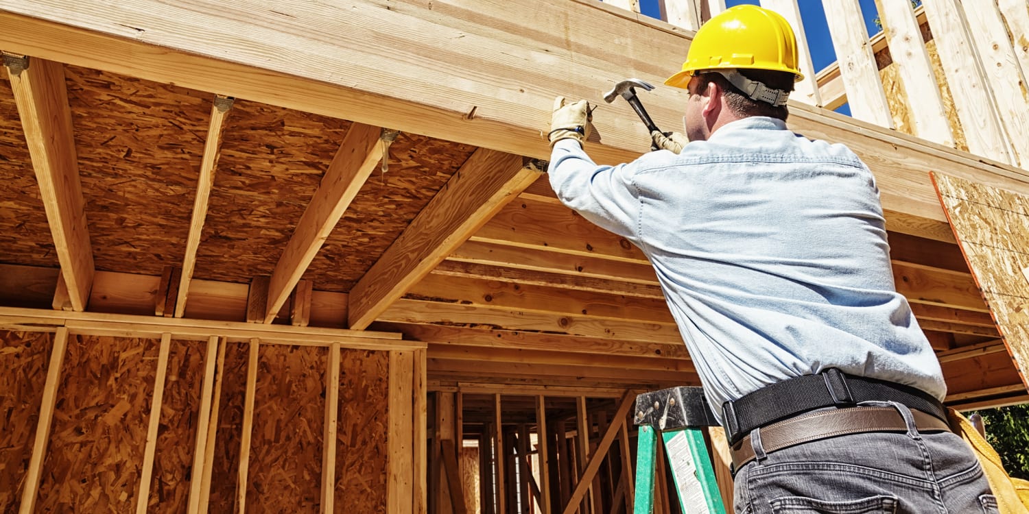 A contractor renovating a home interior