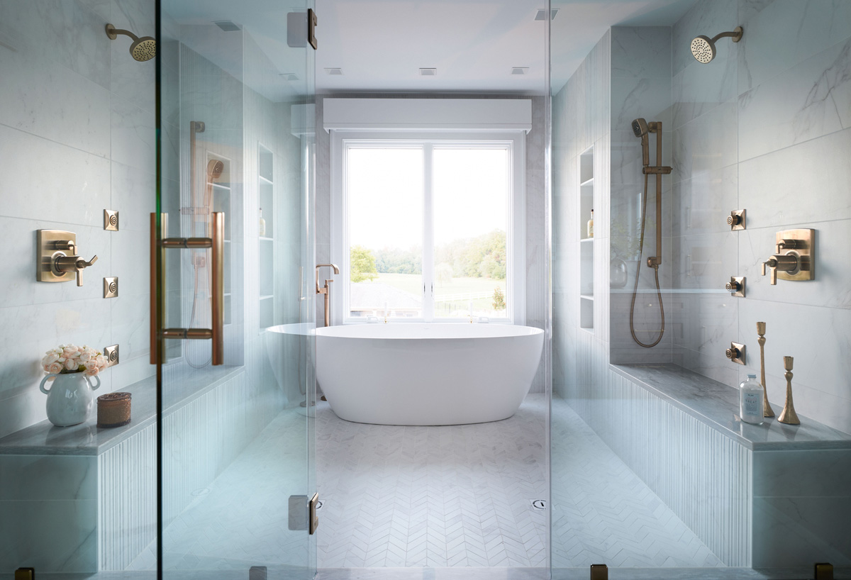 A luxury primary bathroom with a large walk-in steam shower and freestanding tub