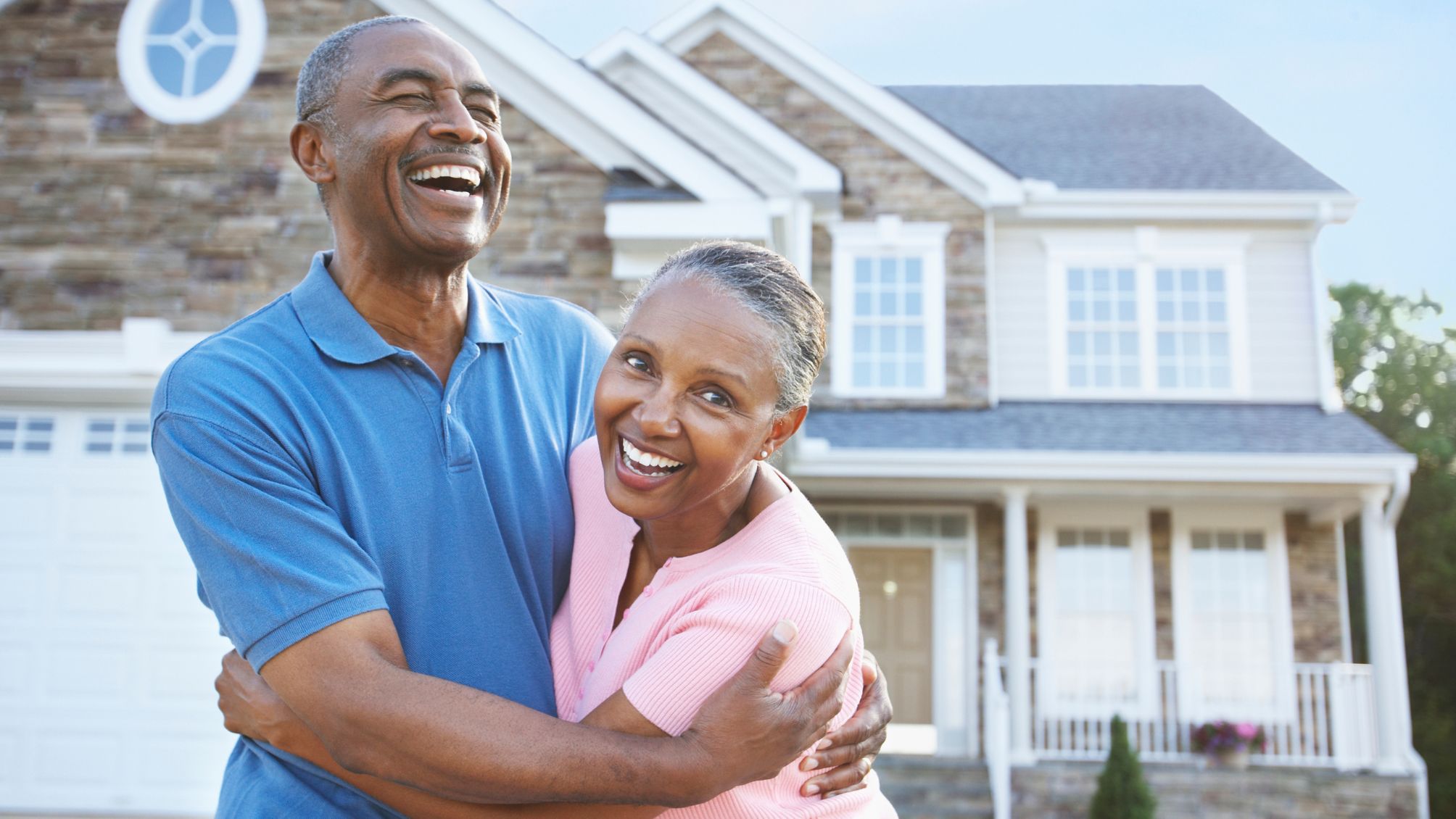 Senior couple reviewing home equity finances at the kitchen table