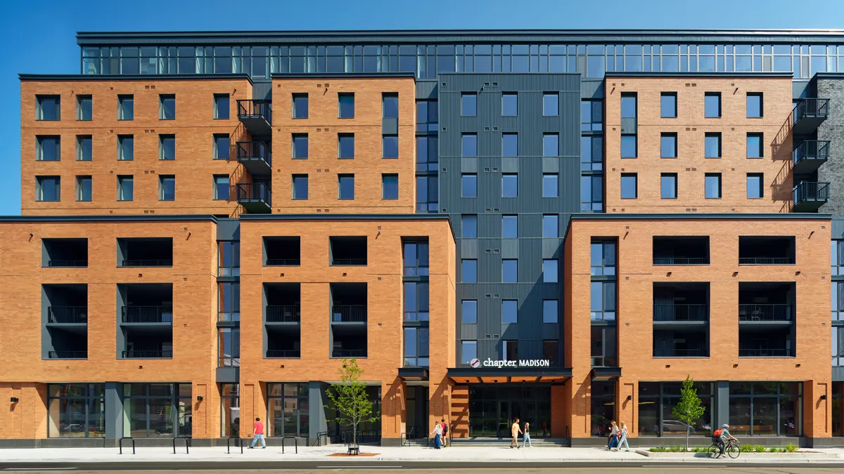 A modern multi-unit student apartment complex near campus