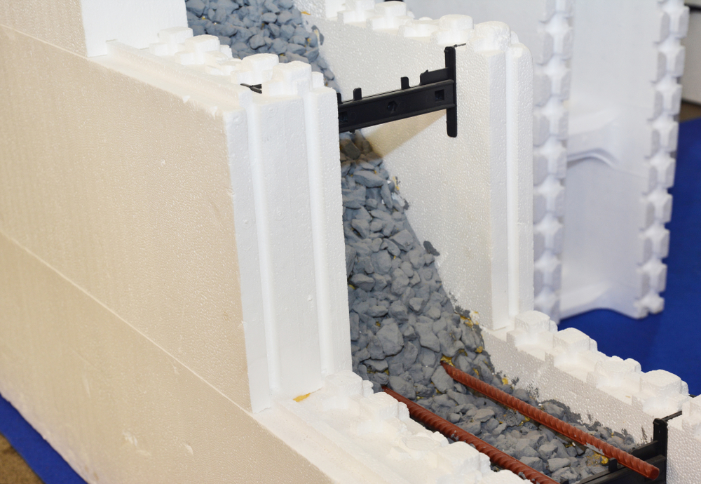 Insulated concrete forms block being laid for a high-performance home shell