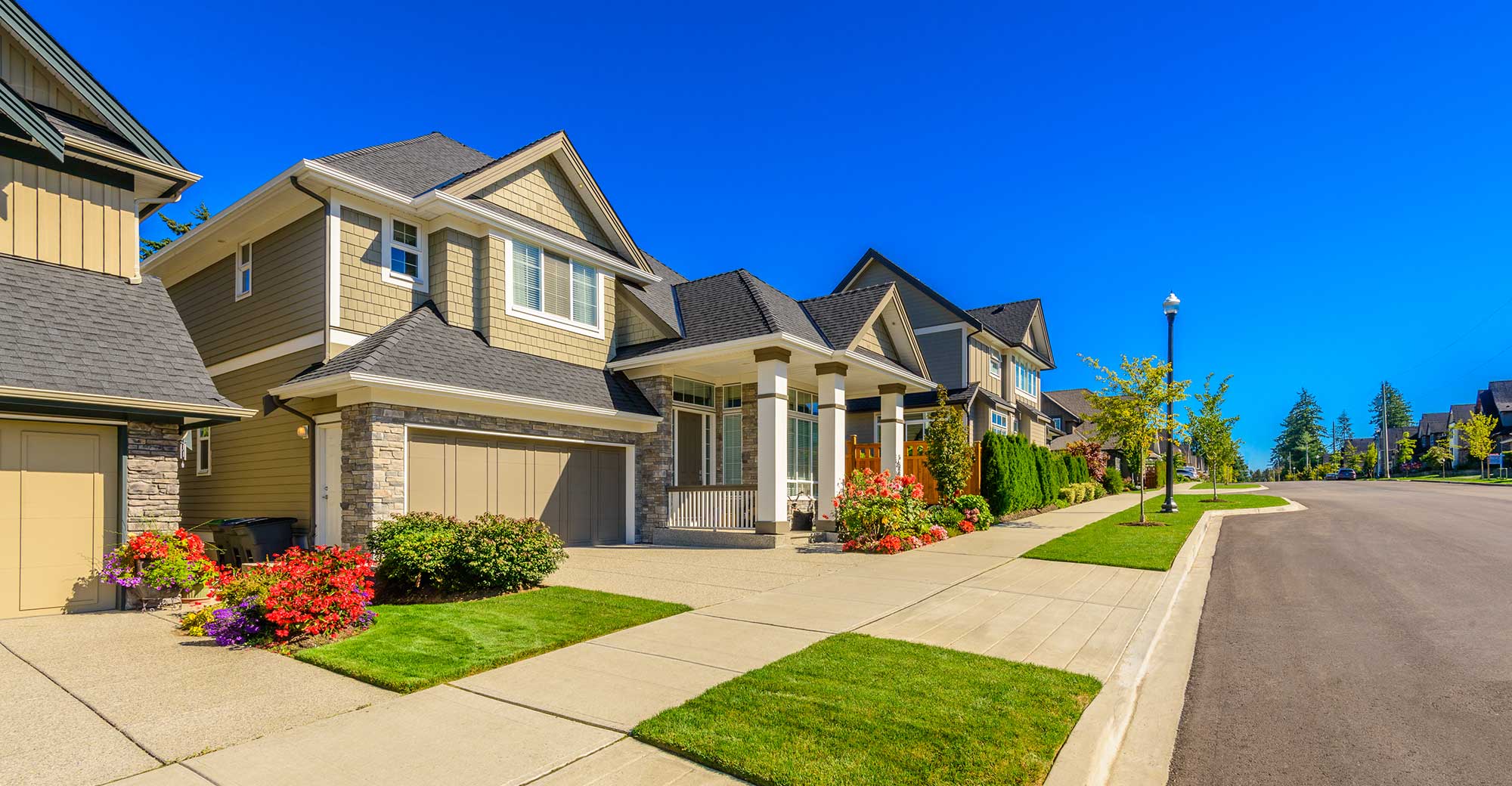 A row of residential properties representing a growing investment portfolio.