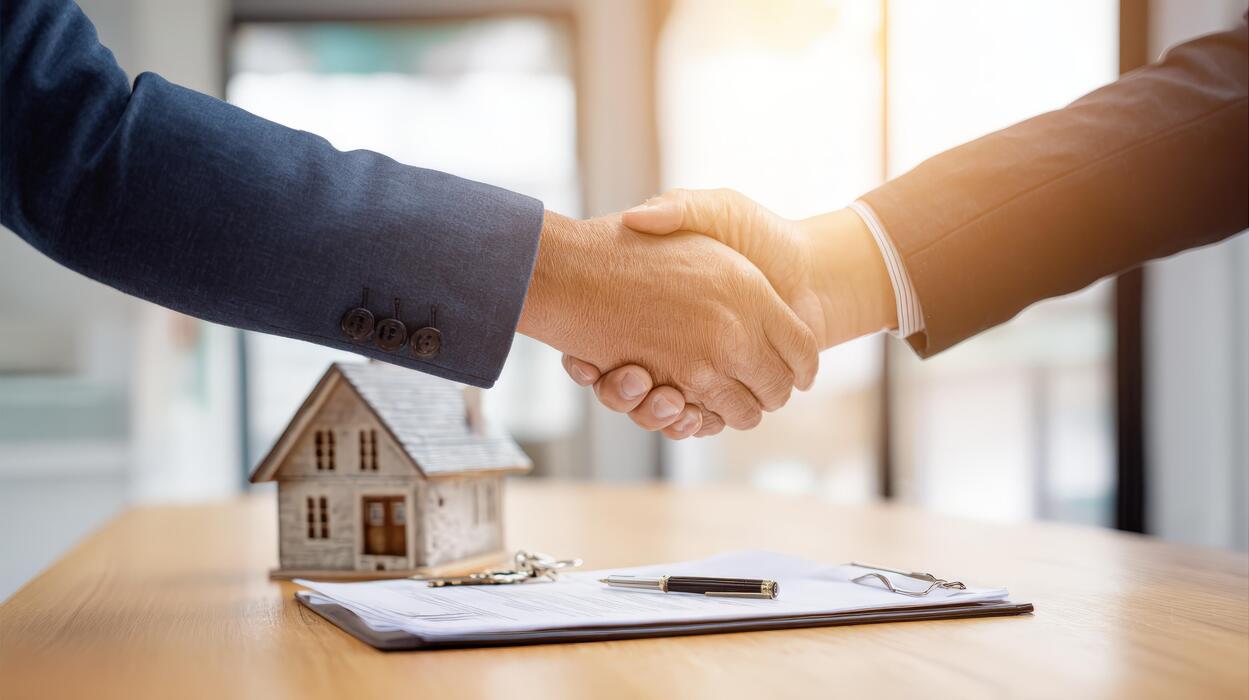 Consulting with a business owner about mortgage options.