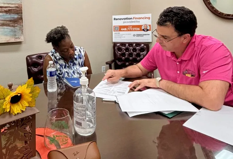 James Hair at a successful 203(k) closing with a happy homeowner in New Orleans.