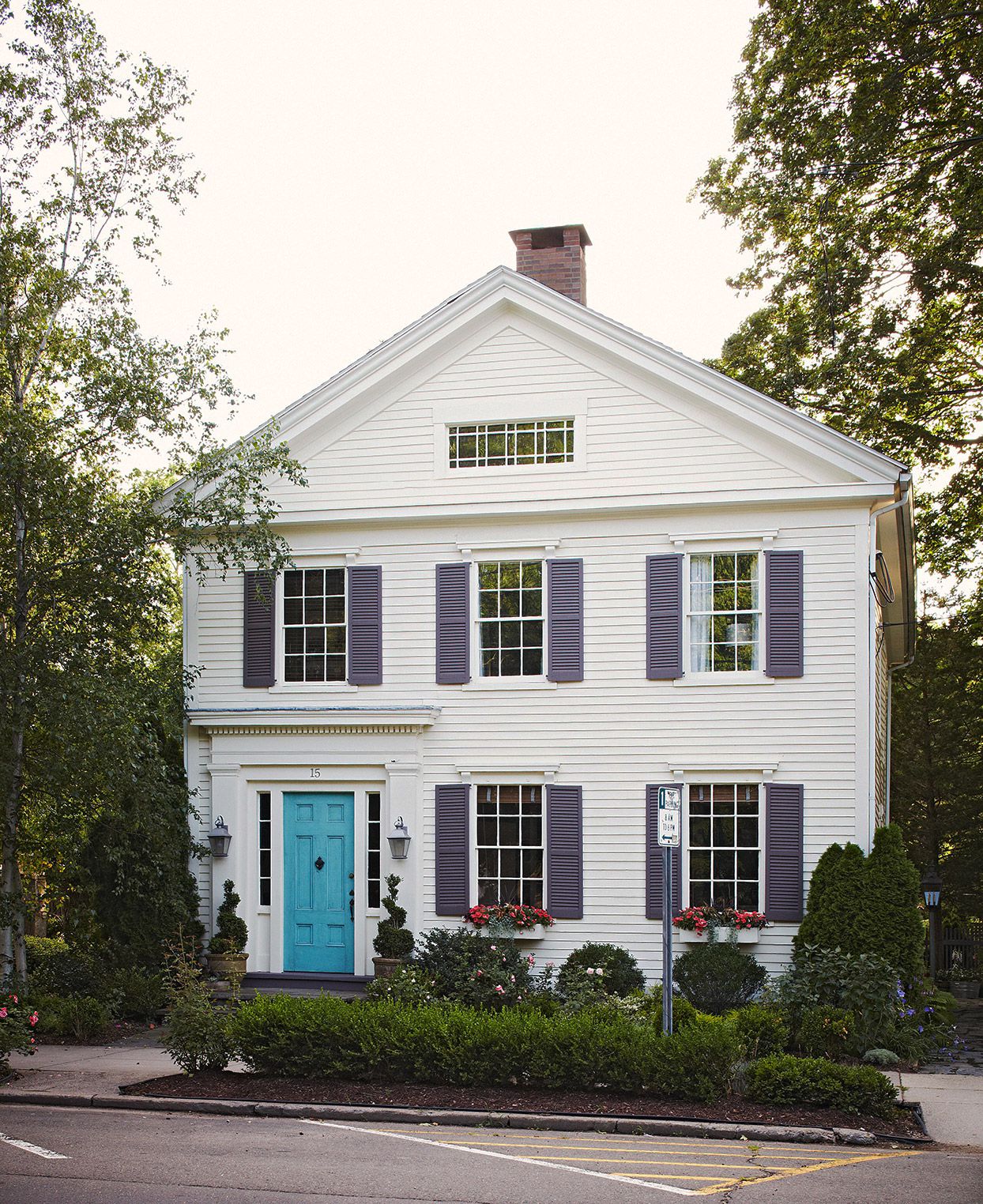 A classic colonial-style American home with a gabled roof