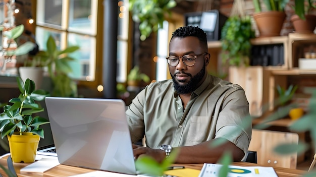 A business owner reviewing financial charts on a laptop to plan their budget