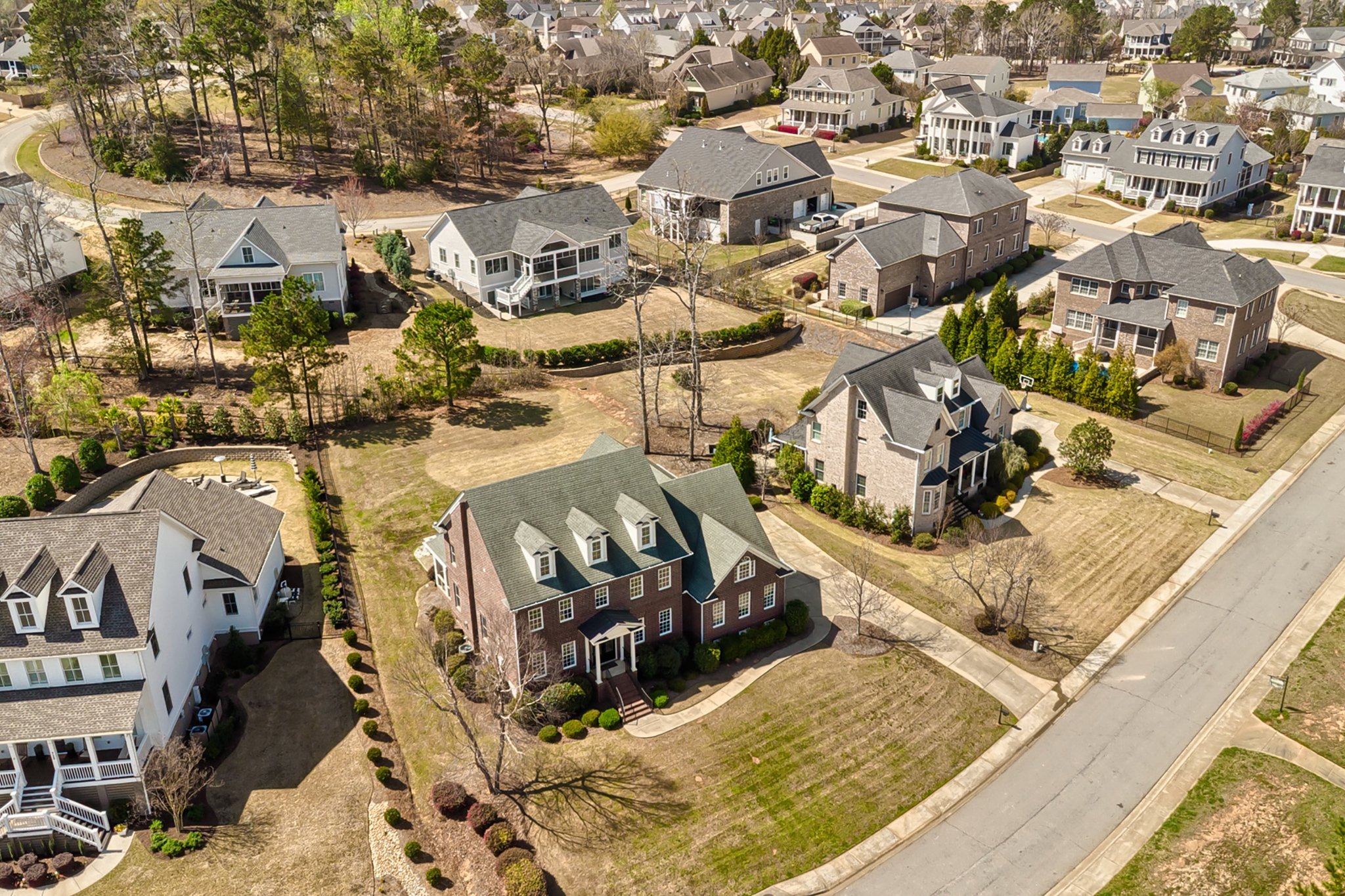 A suburban Lexington, SC home in a tree-lined neighborhood at golden hour