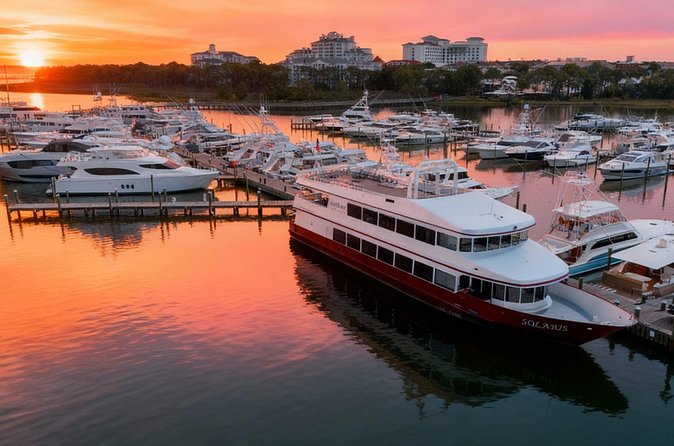 Boats lining the harbor in the evening