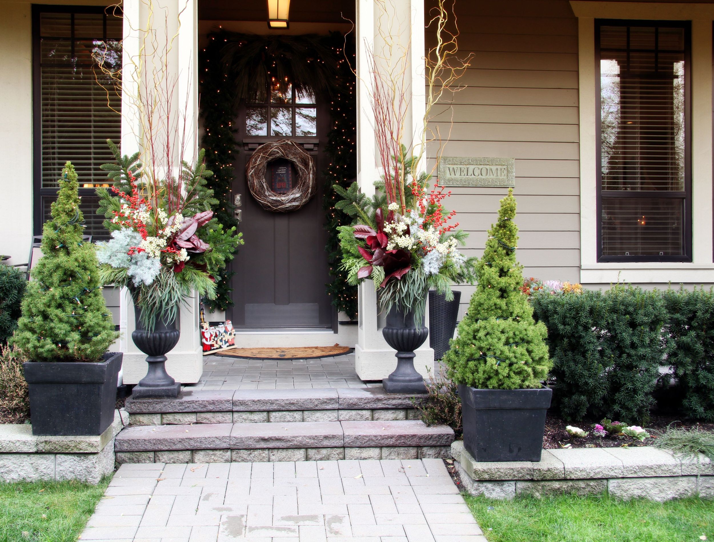 A freshly painted front door with a welcoming entryway and doormat