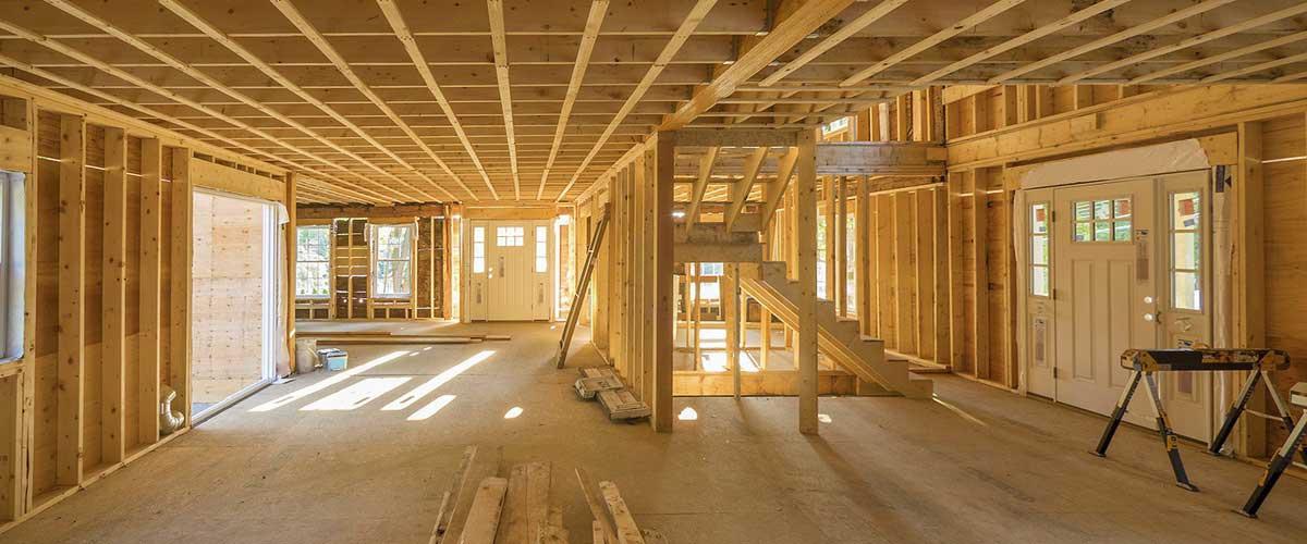 New home construction site with wooden framing
