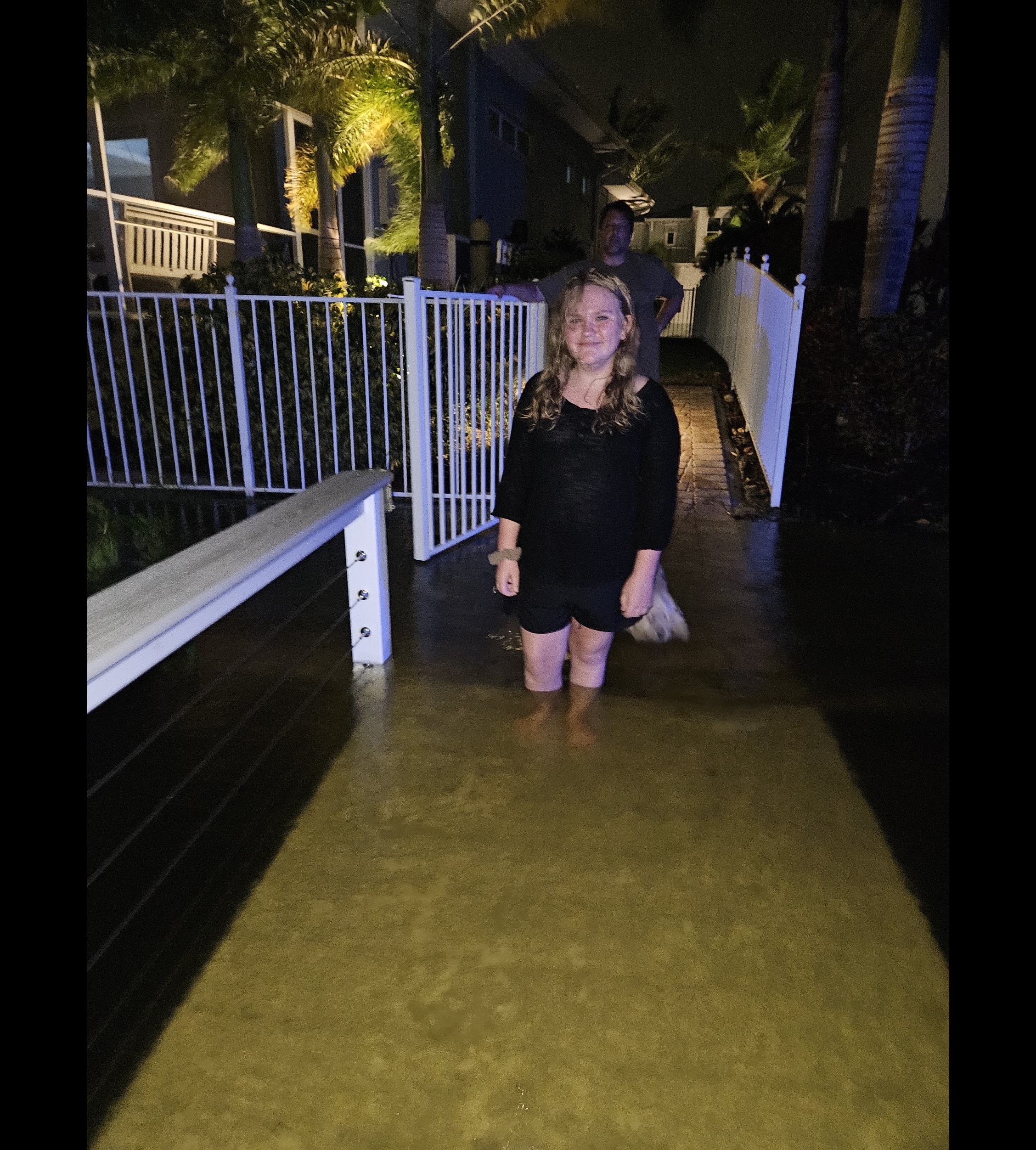Storm surge over the Calvert family dock at night during Hurricane Helene in Apollo Beach, FL