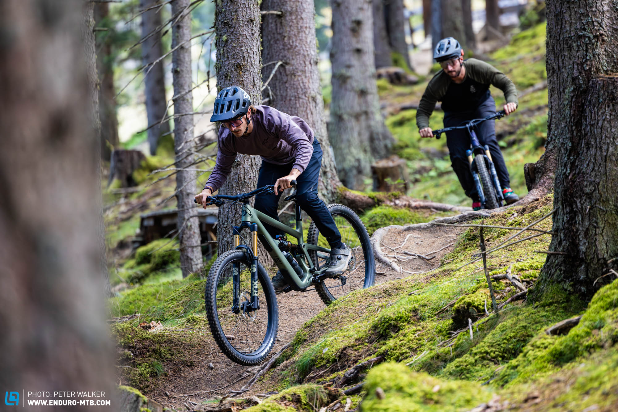 modern full suspension mountain bike on trail forest