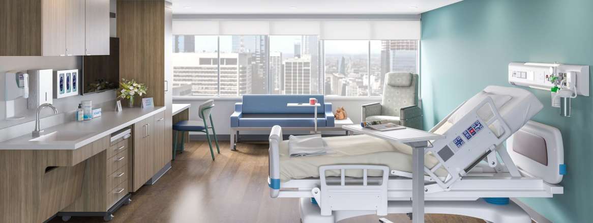 An empty hospital patient room with a bed and medical equipment