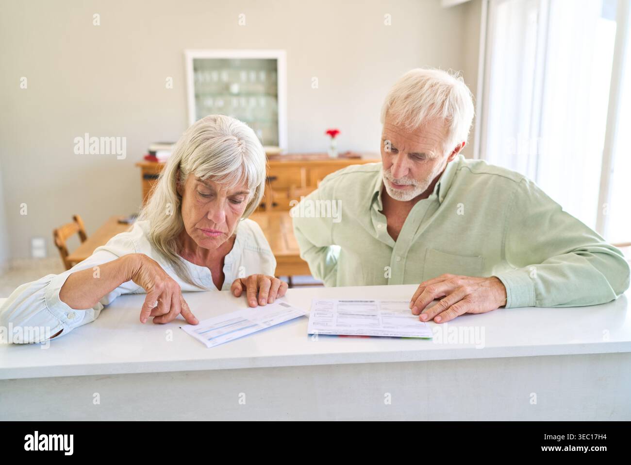Senior couple planning retirement finances at home