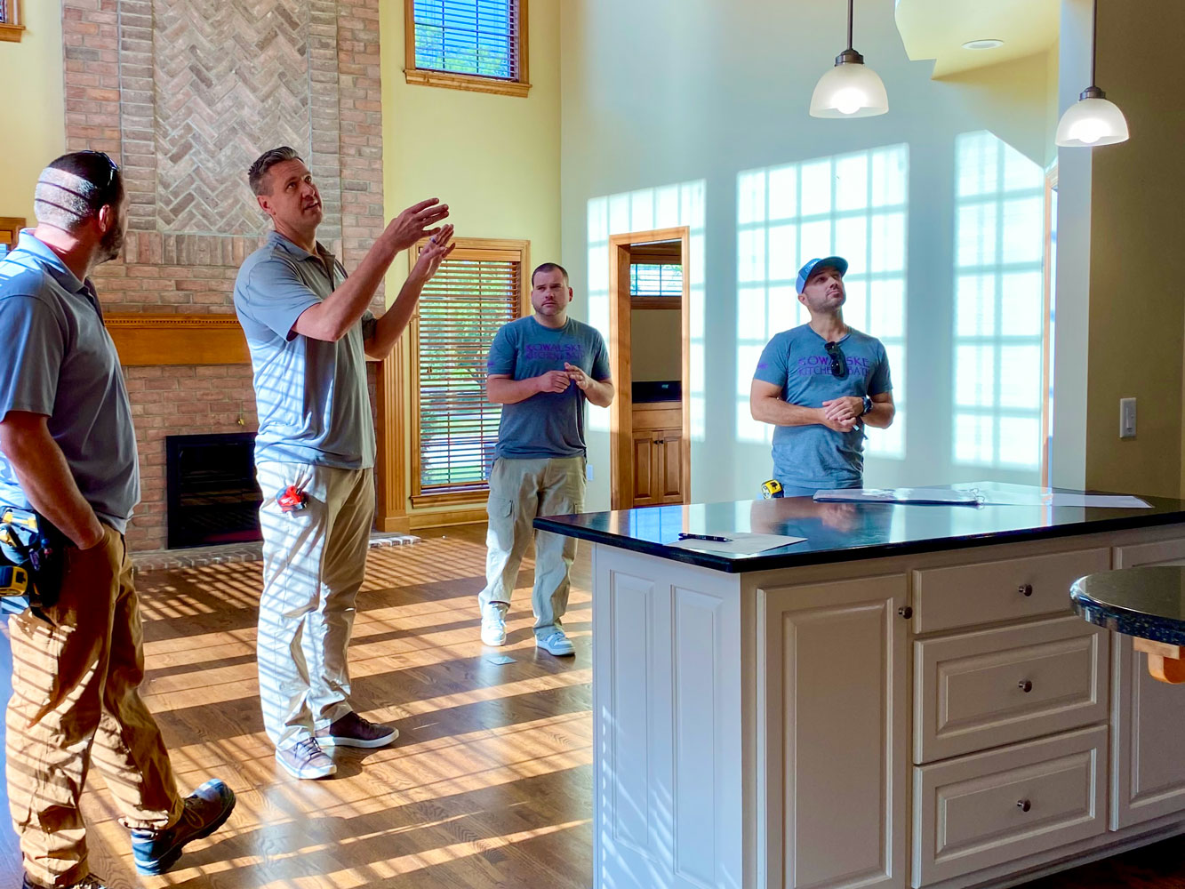 Home renovation in progress, construction workers in a kitchen