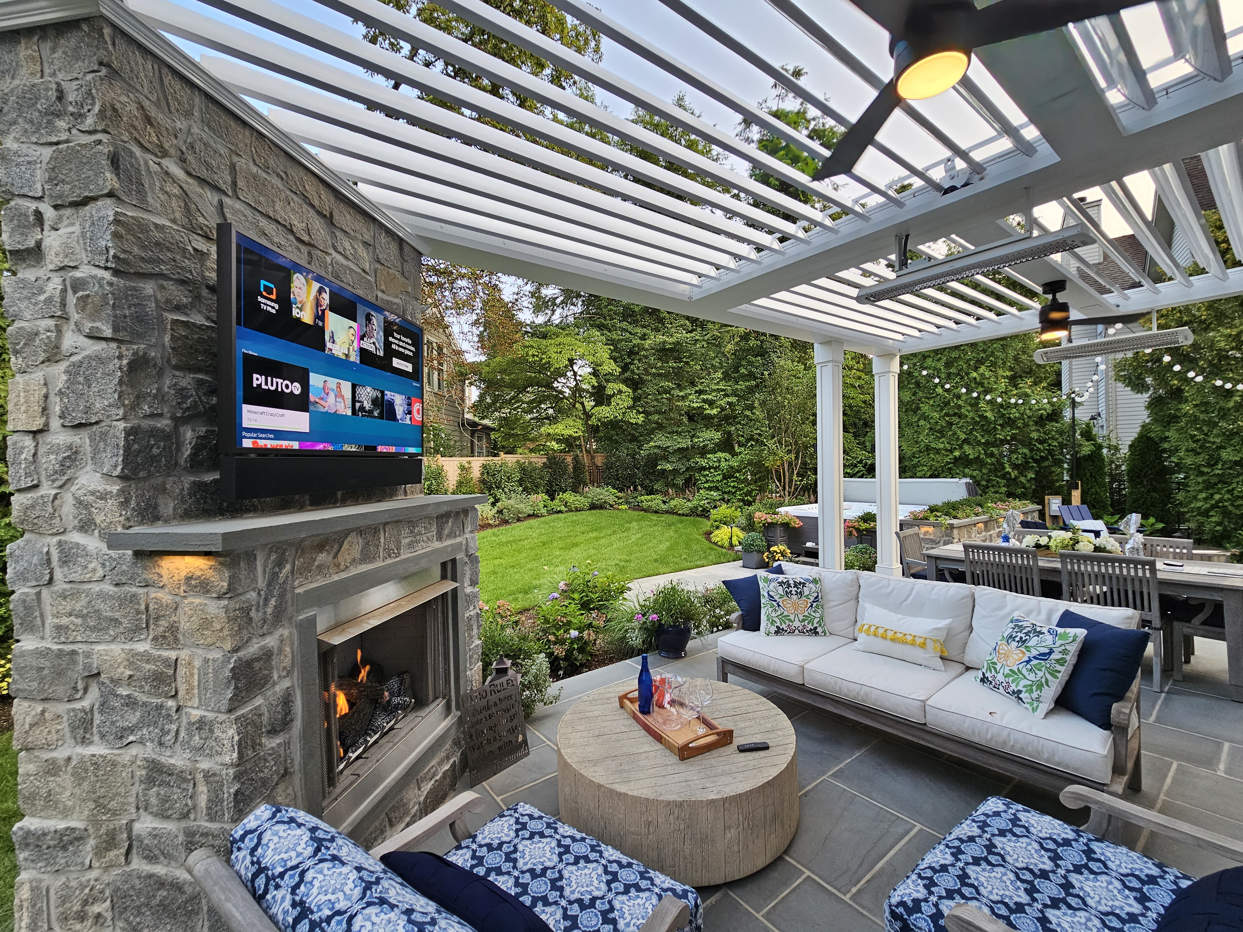covered outdoor living room fireplace