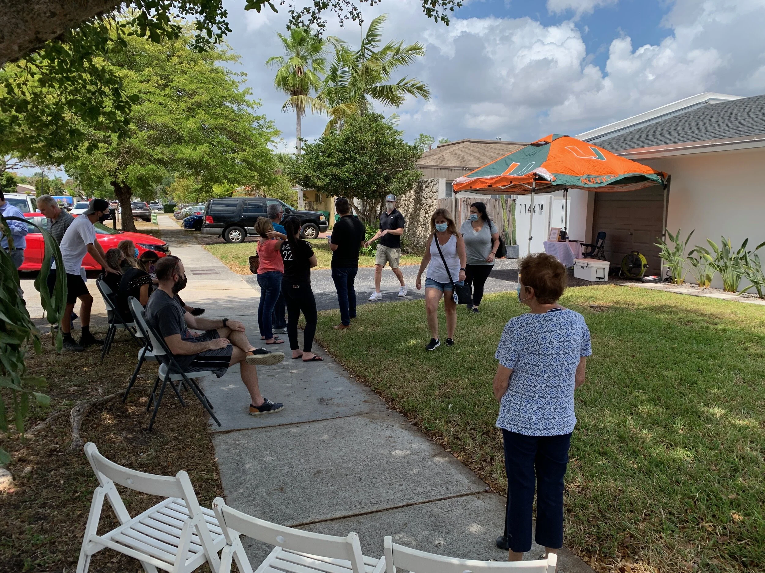 Line of people waiting outside an open house