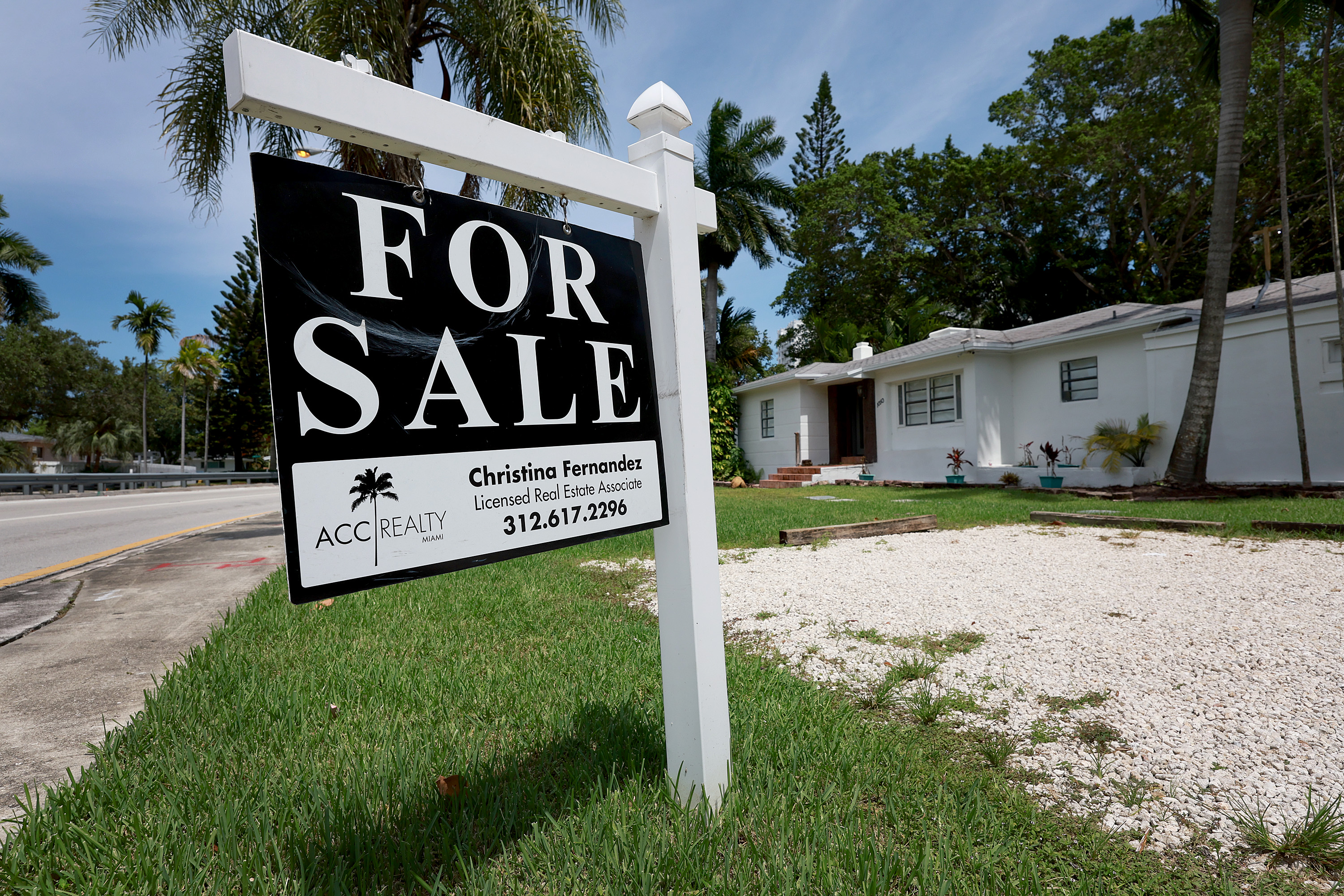 A Florida home with a sold sign in the front yard, representing a successful sale