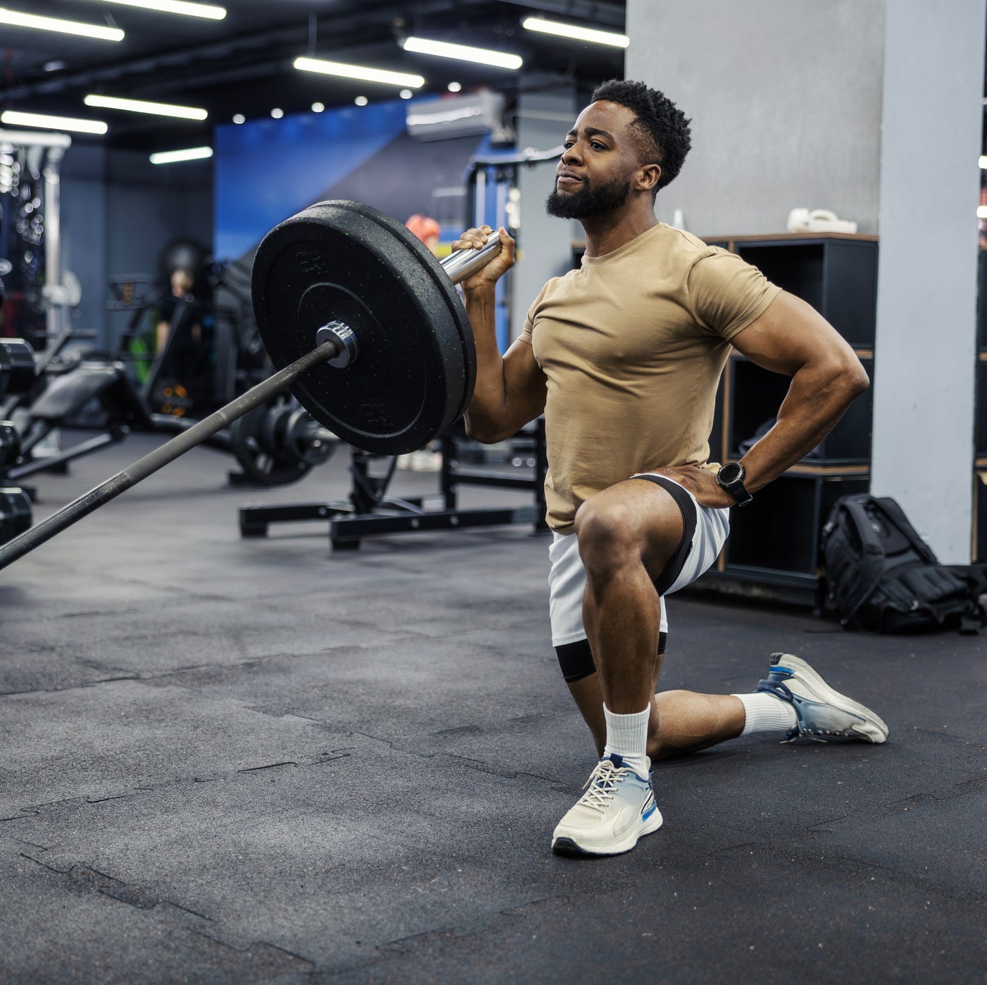 Adults lifting weights in a gym